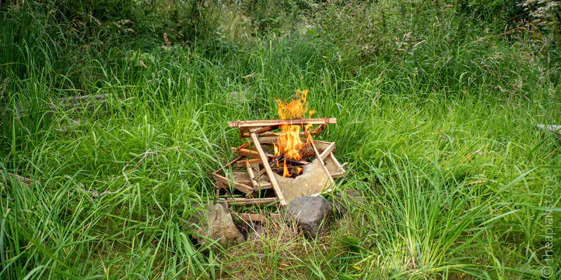A small fire in a woodland clearing